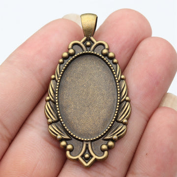 Antique Bronze Oval Cabochon Setting with Decorative Border