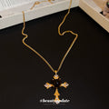 Gold Tone Cross Pendant Necklace With Brown Cabochon Center view 2