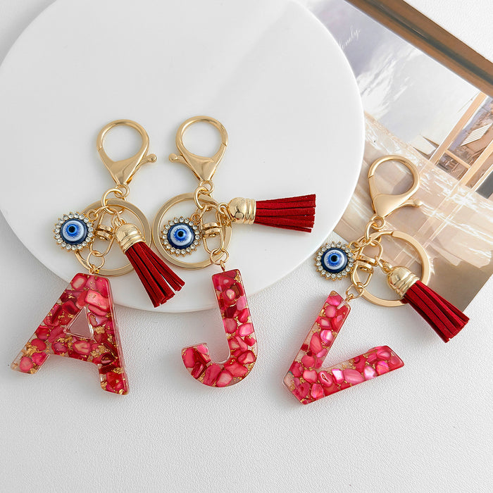 Red Resin Shell Letter Keychain with Evil Eye and Tassel