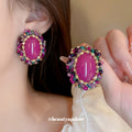 Pink Oval Crystal Vintage Style Stud Earrings with Polished Metal Accents view 1