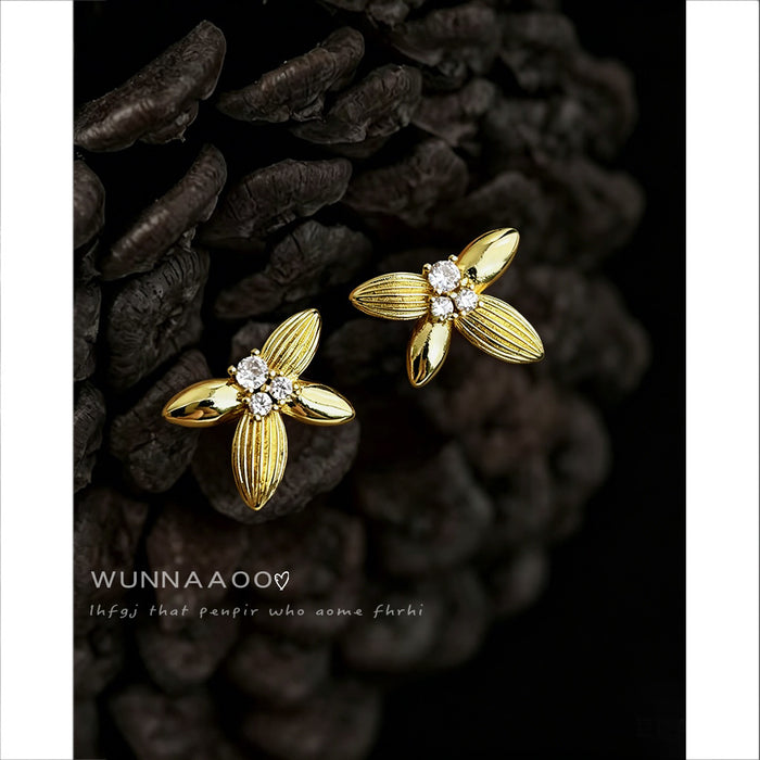 Gold Tone Textured Four Petal Osmanthus Clear Stone Stud Earrings