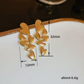 Gold Tone Cascading Leaf Stud Earrings with Polished Metal Finish view 5