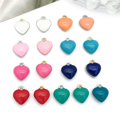 Colorful heart charms arranged on a light background