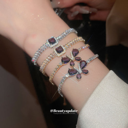Wrist stacking purple square and butterfly crystal bracelets