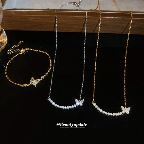 Gold butterfly bracelet with silver and gold pearl butterfly necklaces