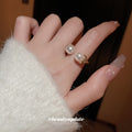 Textured Gold Tone Open Ring With Two Unequal Pearl Like Ends view 4