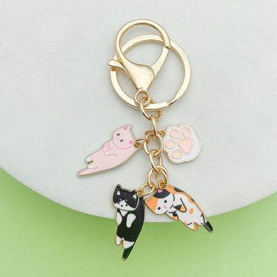 Image 1 showing a keychain with three different animal charms.