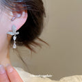 Crystal Butterfly and Teardrop Earrings with Polished Metal Details view 4