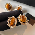 Amber Oval Stud Earrings with Clear Crystal Halo Frames view 3