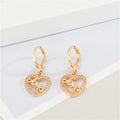 Gold Tone Crystal LOVE Heart Pendant Necklace and Huggie Earrings view 3