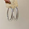 Polished Double Hoop Earrings In Gold And Three Silver Sizes view 6