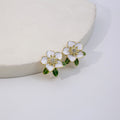 White Enamel Camellia Flower Stud Earrings Green Leaves view 4