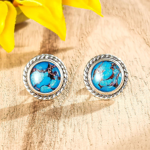 Front product view of the round turquoise color centers in rope edged settings