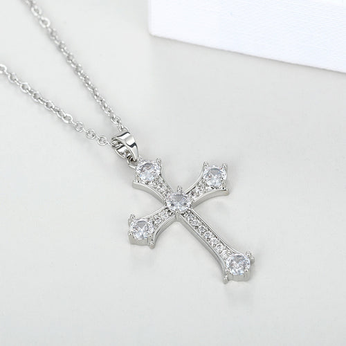 Product view showing clear-stone cross pendant necklace