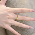 Slim Gold Tone Bamboo Segment Ring With Small Green Center Stone view 3