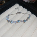 Three Pale Blue Crystal Bracelets With Oval Heart Or Mixed Centers view 8