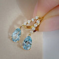 Gold Tone Light Blue Teardrop Drop Earrings Clear Line view 3