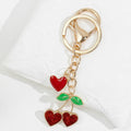 Gold Heart Clasp Charm Keychain With Bow Cherry Accent view 10