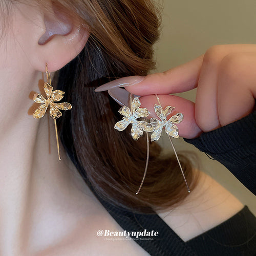 Silver Iris earrings in product display