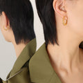 Twisted Rope Oval Hoop Earrings Gold Steel Metal Finish view 1