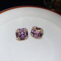 Gold Tone Square Stud Earrings with Purple Crystal Centers view 6