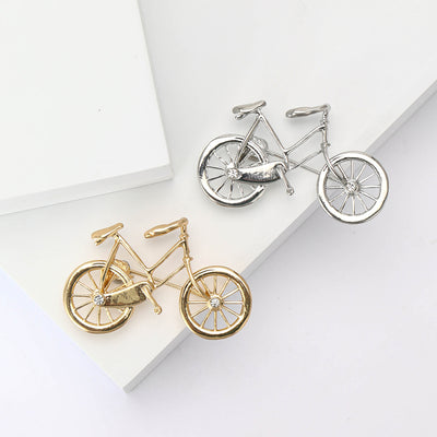 Metal Outline Bicycle Brooch isolated front view