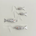 Silver Tone Textured Fish Dangle Earrings Orange Crystal Eyes view 1