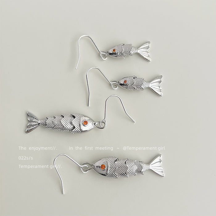 Silver Tone Textured Fish Dangle Earrings Orange Crystal Eyes