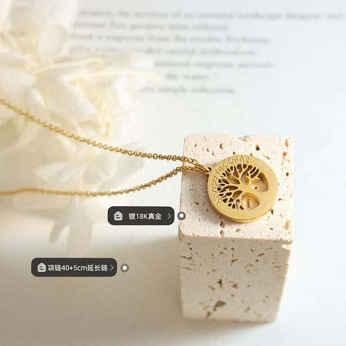 Pendant on stone block showing tree cutout and product labels