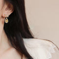 Green Teardrop Crystal Bow Stud Earrings With Polished Metal Details view 2