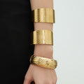Gold Steel Wide Sunburst Cuff And Textured Hinge Bangles view 4