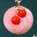 Twin Persimmon Plush Pom Keychains in Fifteen Listed Loop Colors view 1