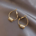 Gold Tone Twisted Hoop Earrings With Crystal Barrel Charms view 3