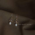 Gold Tone Bird Arch And White Pearl Drop Hook Earrings view 3