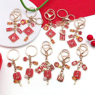 Overview showing the available color and design variations of the red lunar festival keychains and phone strap charms