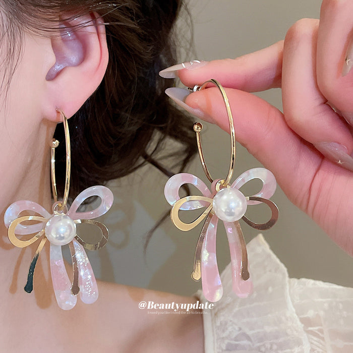 Pink Iridescent Bow Dangle Earrings With Gold Tone Hooks