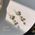 Gold Tone Green Leaf White Flower And Pearl Long Hook Earrings view 3