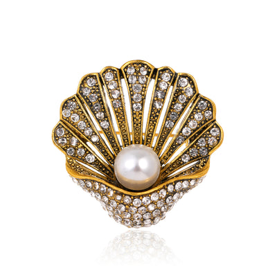 Front product view of the shell brooch pin in gold and silver