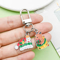 Christmas Charm Keychains Featuring Silver Santa Across 41 Pictured Variations view 3