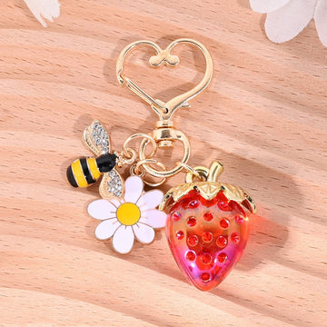 Gold-Tone Strawberry Charm Keychain With Daisy And Bee Accents