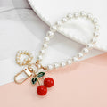 Red Cherry Charm Bag Keychain with Gold-Tone Hardware view 6