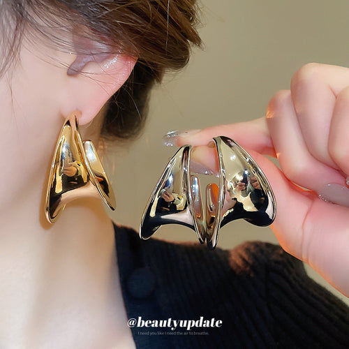 sculptural c hoop stud earrings displayed from a second angle