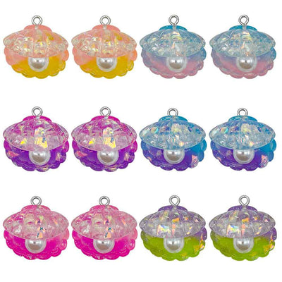 Iridescent shell charms pictured with visible surface details