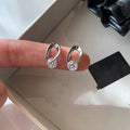 Silver Tone Oval Huggie Earrings with Clear Teardrop Crystals view 3