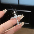 Dainty Crystal Cross Ear Clips in Gold and Silver Tone Finishes view 4