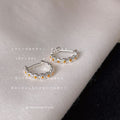 Silver Tone Daisy Flower Mini Hoop Huggie Earrings view 1