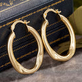 Gold Tone Irregular Oval Textured Hoop Earrings Pair view 3