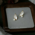 Gold Tone White Leaf And Pearl Accent Stud Earrings For Women view 1