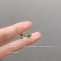 Gold Mini Huggie Hoop Earrings Green Rectangular Baguette CZ view 4