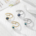 Twisted Band Blue Evil Eye Open Rings in Four Finishes view 1